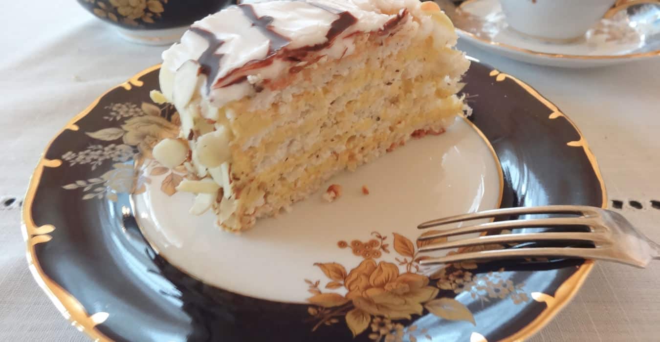Slice of Esterházy Torte on a fine china plate. 