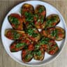 Pan Fried Eggplant with Tomato Confit on a plate.
