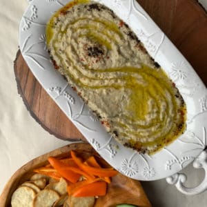 Mutabal with pita chips and fresh vegetables.