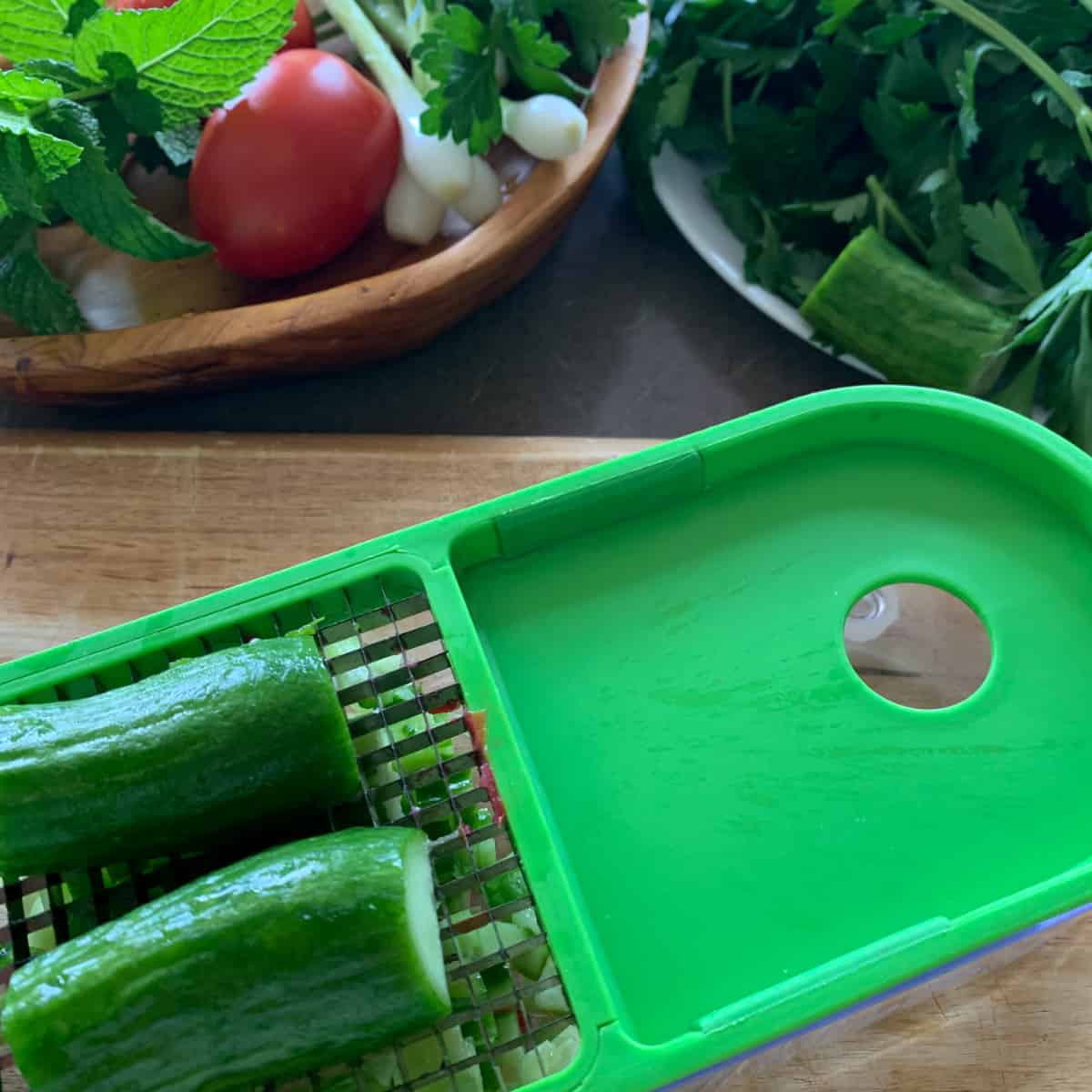 Cucumbers on a  vegetable dicer. 