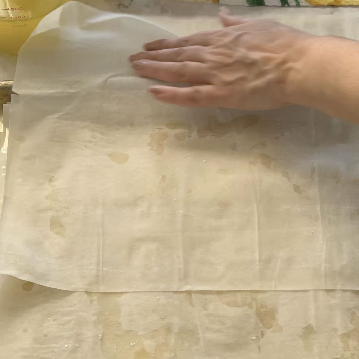 Overlapping the phyllo sheets.