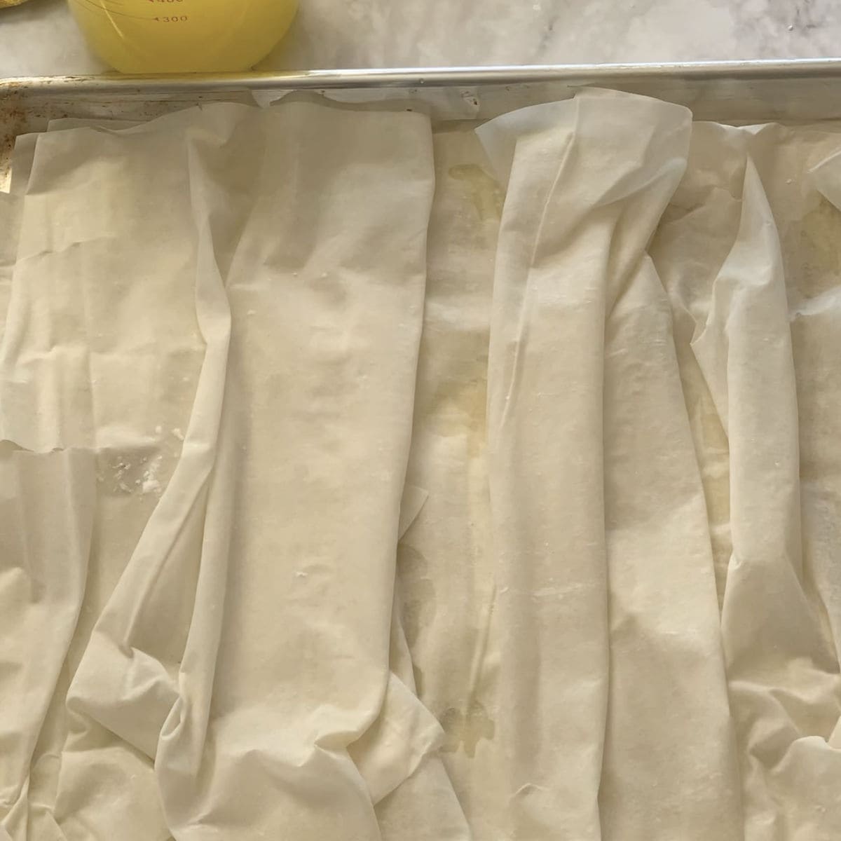 Pleating the phyllo sheets.