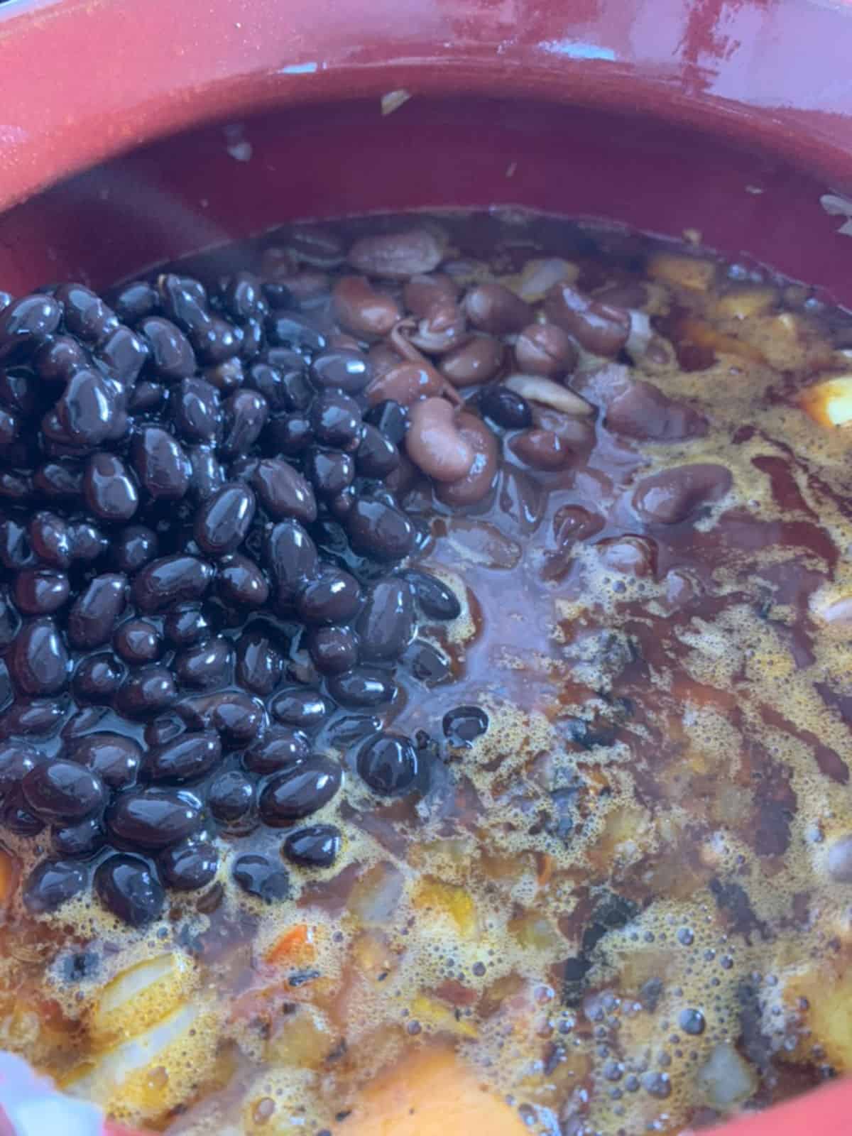 Three bean chili step-by-step adding beans.
