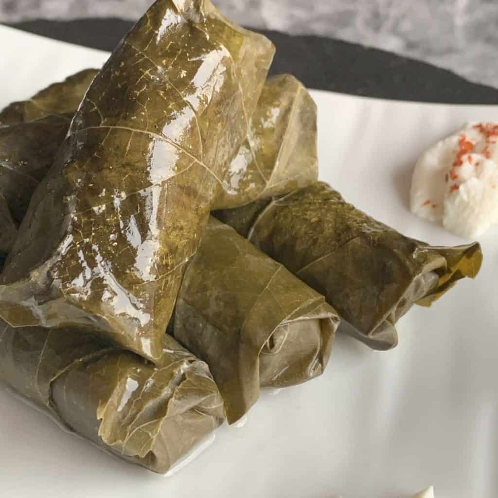 Grape leaf tolma with yogurt.