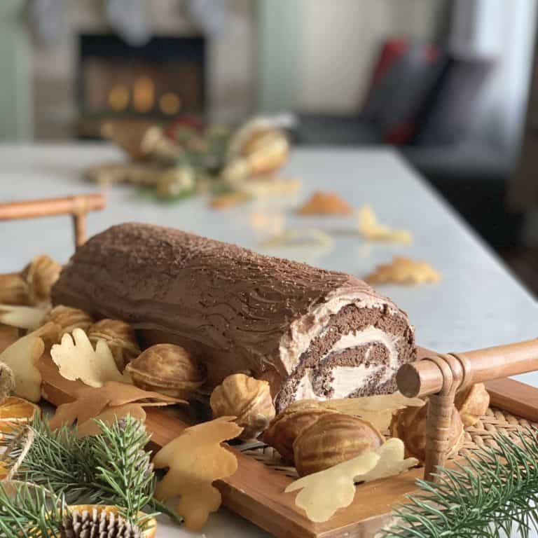 Buche De Noel Tiramisu-Cake in front of the fireplace.