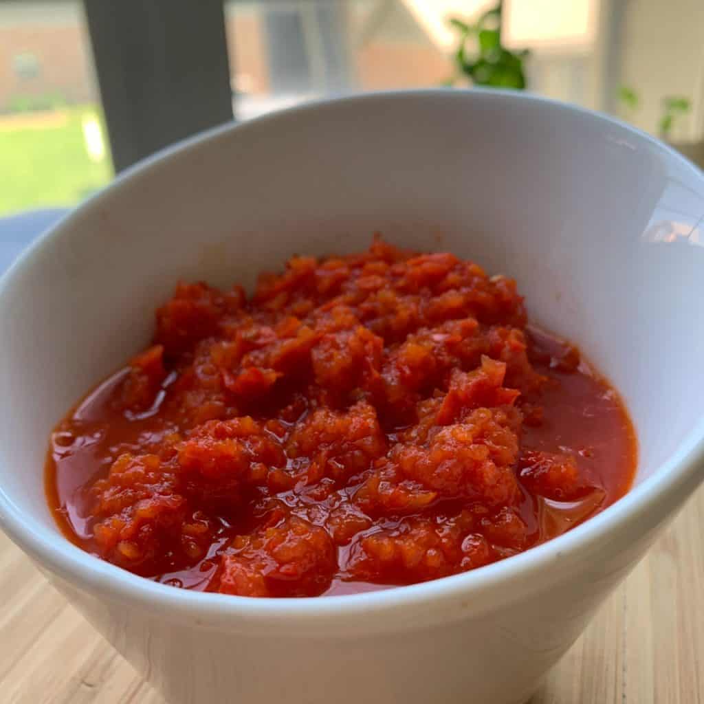 Fresno Red Pepper Paste in a white dish.