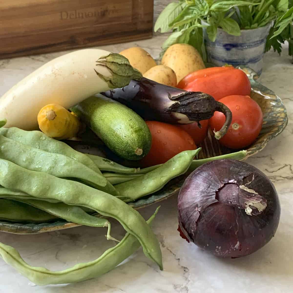 Eggplants, zucchini, onion, eggplants, beans, and tomatoes.