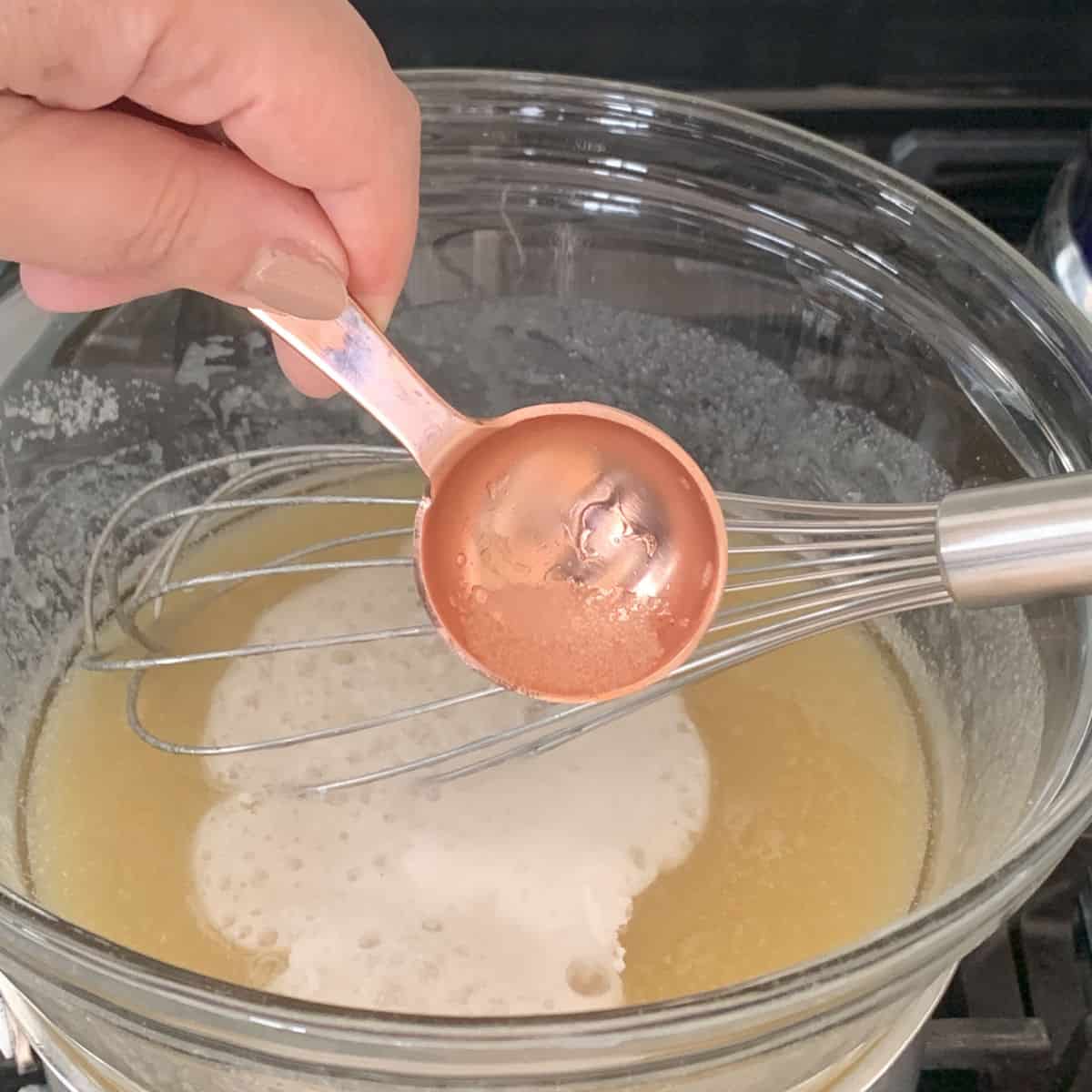 Adding baking soda and vinegar to a batter.  