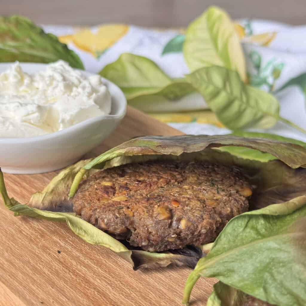 Side view of the lentil balls in lemon leaves.