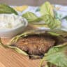Side view of the lentil balls in lemon leaves.