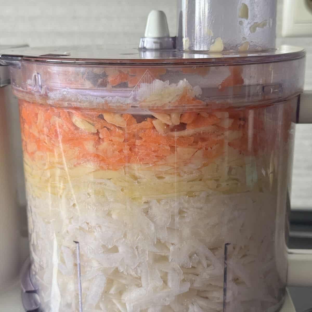 Chopped veggies in a food processor.