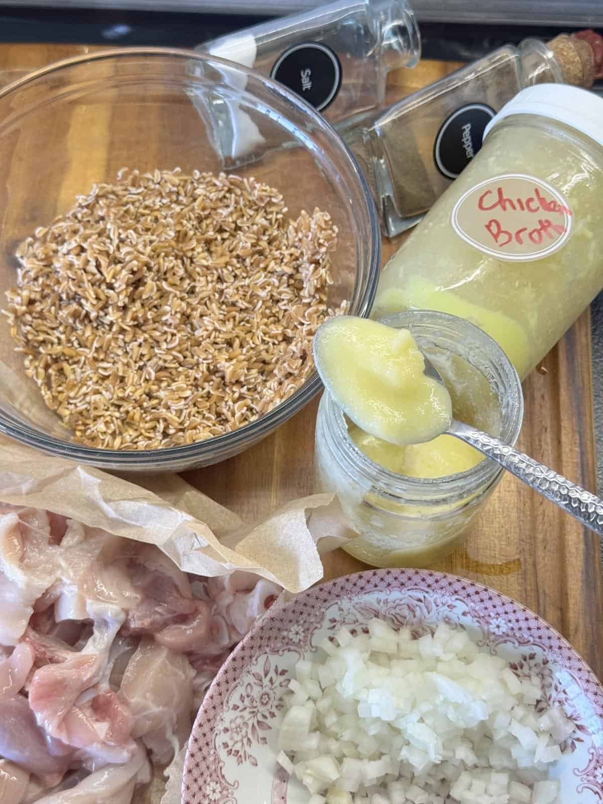 A close-up of fresh ingredients used in farro pilaf with chicken.